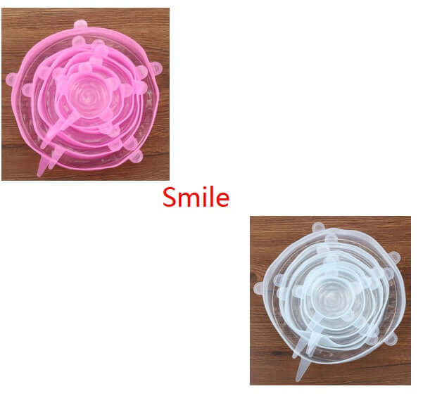 Pink and clear silicone stretch lids sets on wood, reusable food covers, kitchen accessories