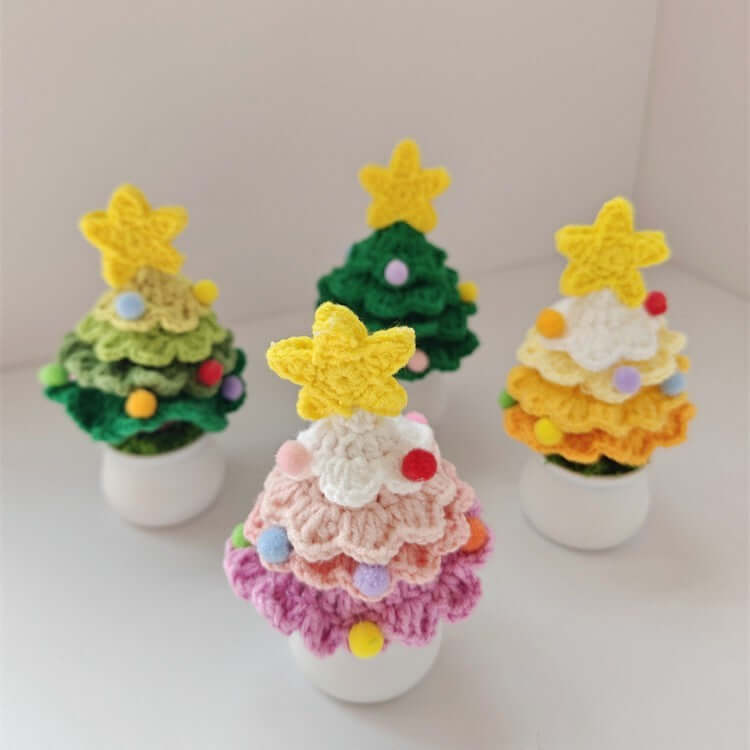 Colorful crochet Christmas tree decorations with star toppers in small pots