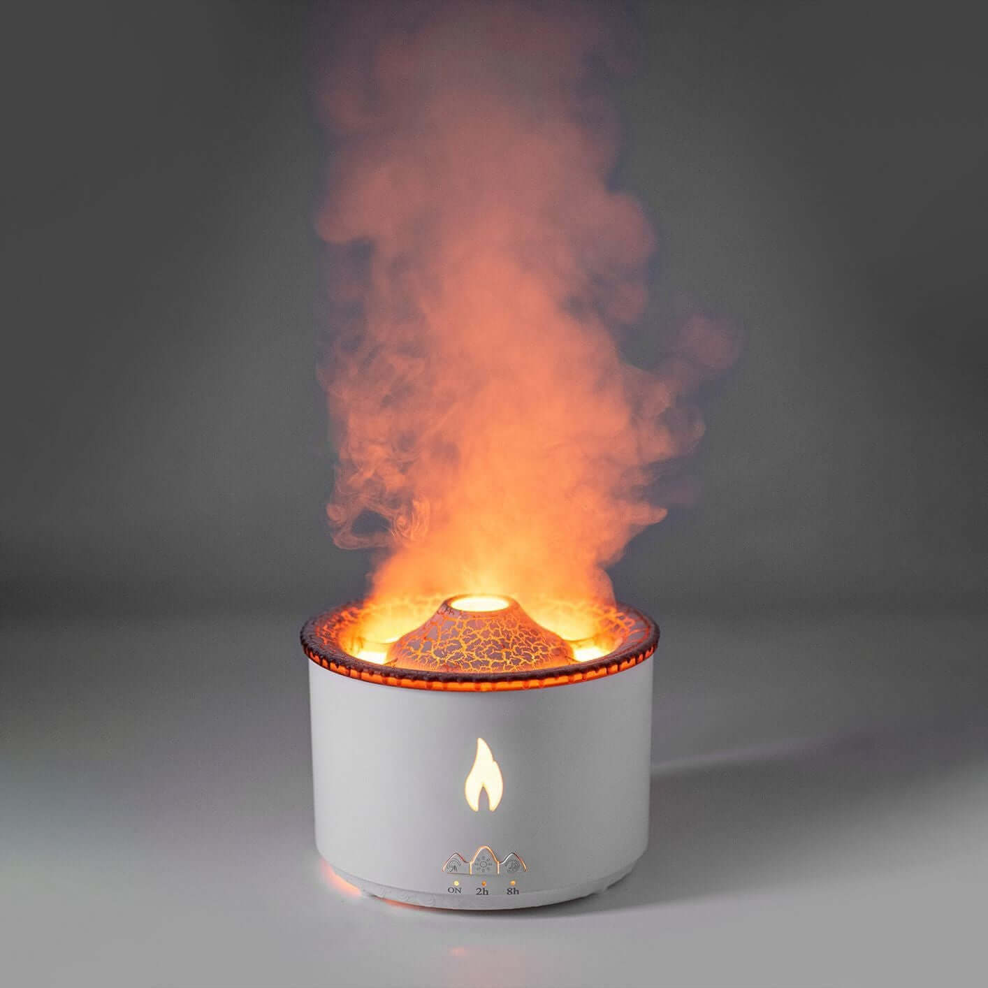 Modern aromatherapy diffuser with flame effect and steam mist on a gray background