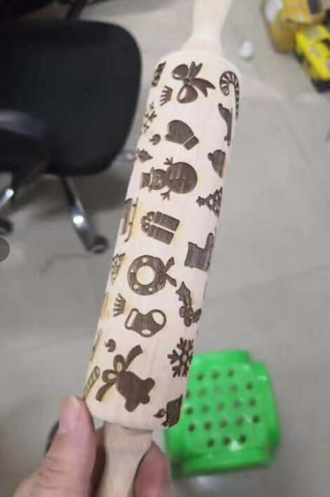 Wooden embossed rolling pin with Christmas-themed patterns for baking cookies