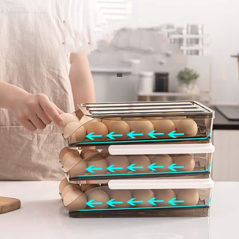 Stacked rolling egg storage containers on kitchen counter, hand grabbing an egg