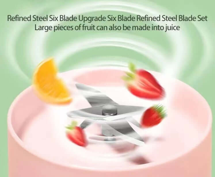 Blender with six stainless steel blades blending strawberries and orange slice for juice