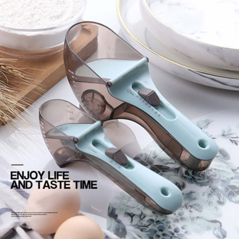 Adjustable measuring scoops with clear markings, light blue handles, on a kitchen counter