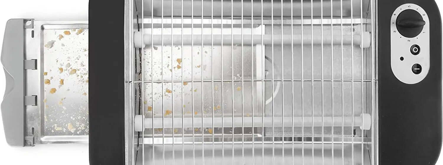 Top view of an electric grill with a crumb tray, adjustable timer, and stainless steel rack