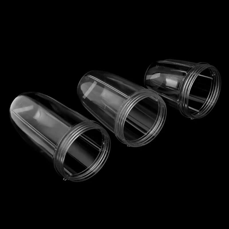 Set of three clear plastic blender cups for kitchen appliances on black background