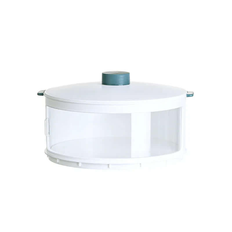 Round white kitchen storage container with clear sides and teal handle lid