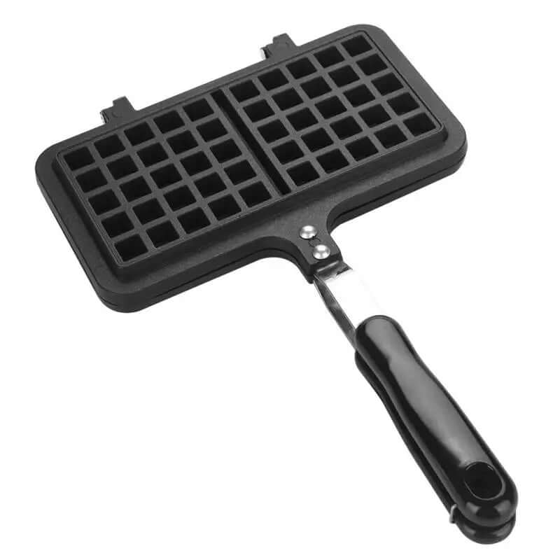 Black stovetop waffle maker with non-stick grid plates and a black handle on white background