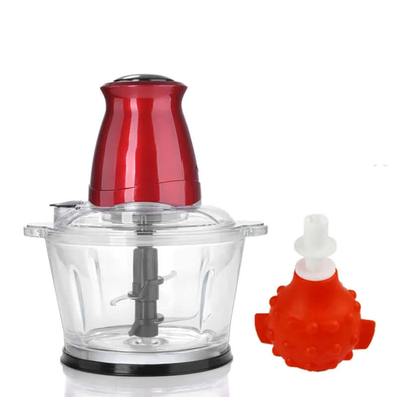 Electric food chopper with red motor and clear bowl, plus red garlic peeler accessory