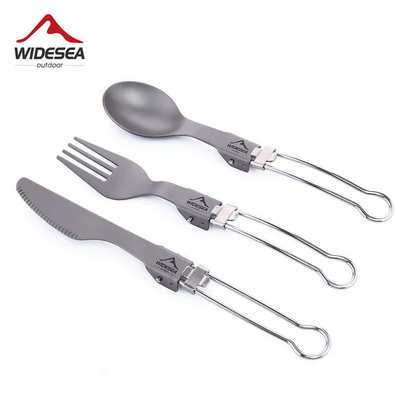 Set of foldable titanium camping utensils, including spoon, fork, and knife, on white background