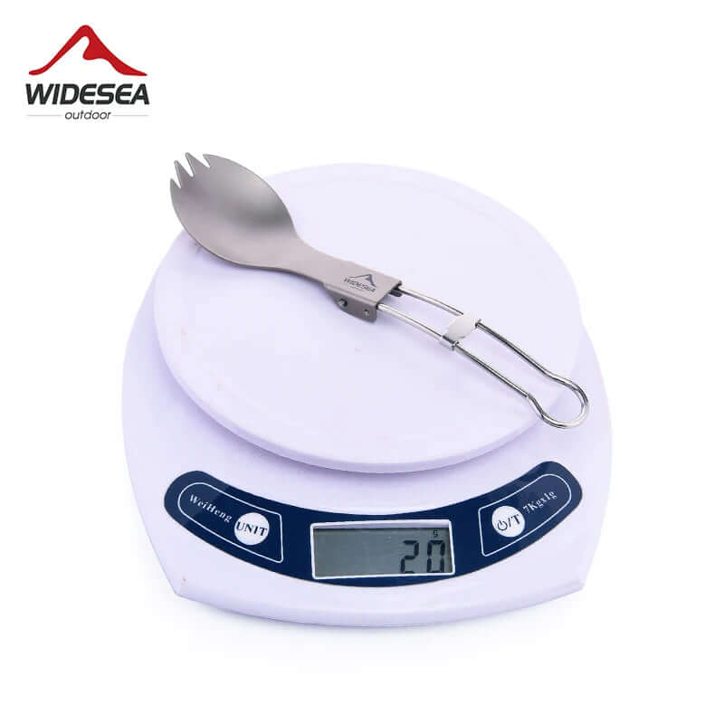 Foldable titanium spork utensil on digital kitchen scale, camping and kitchen accessory