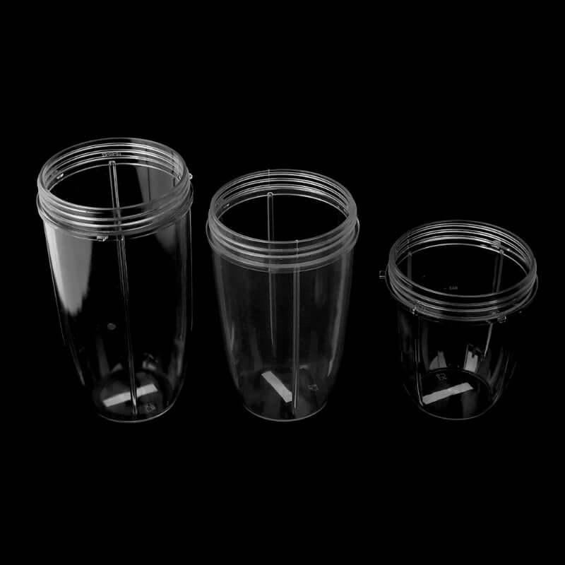 Set of three clear blender cups for kitchen appliances, various sizes on black background