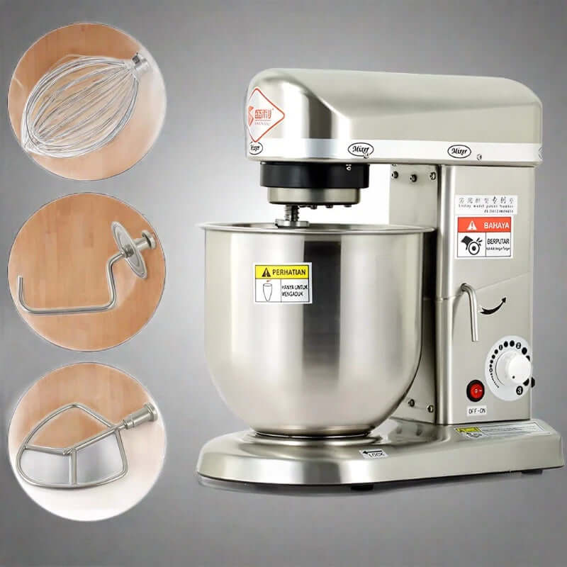 Stainless steel stand mixer with mixing bowl and three attachments on a plain background