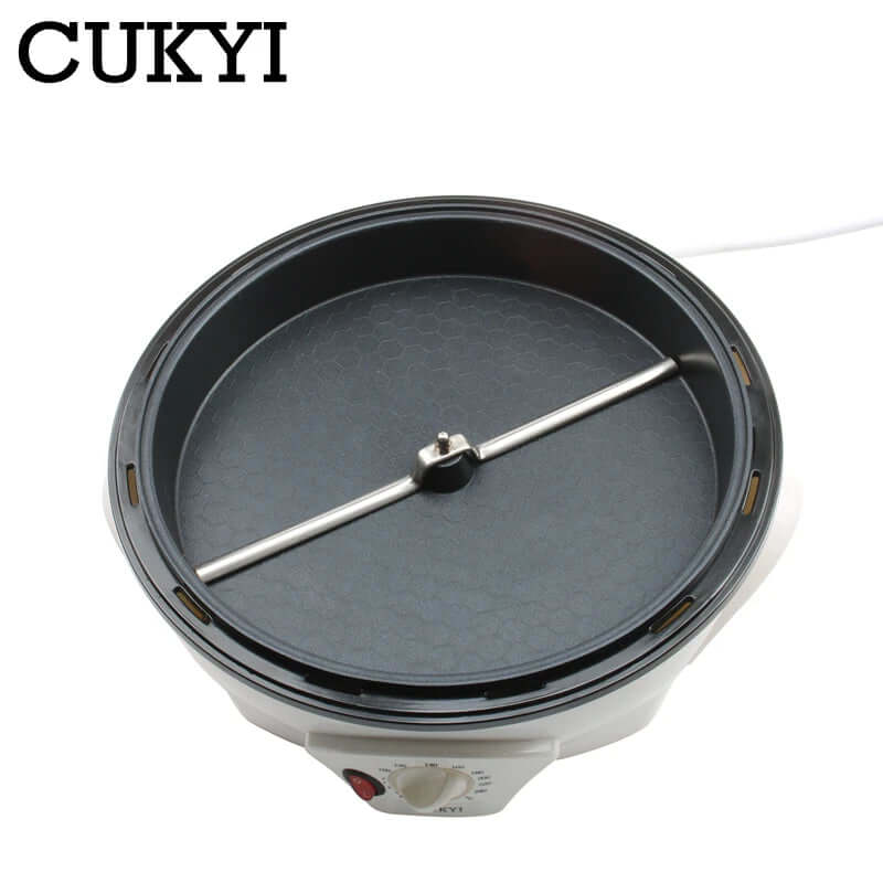Electric crepe maker with non-stick plate, temperature control dial, and spreading bar