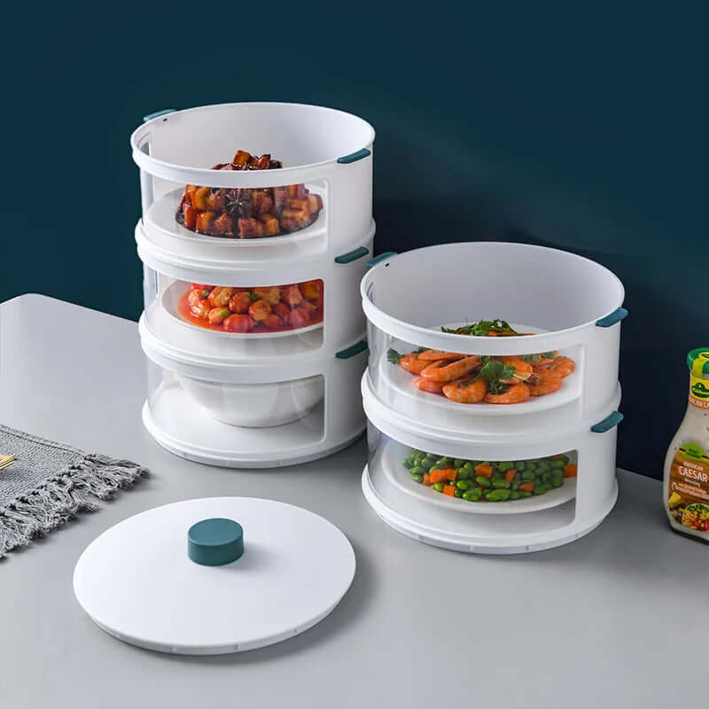 Stackable kitchen food storage containers with handles, filled with assorted dishes.