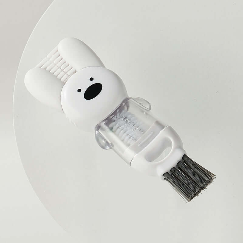 Cute animal-shaped kitchen cleaning brush with bristles and white handle on white background