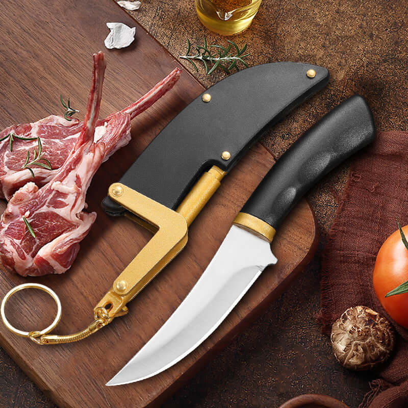 Curved kitchen knife with black handle and sheath on cutting board with raw lamb chops.