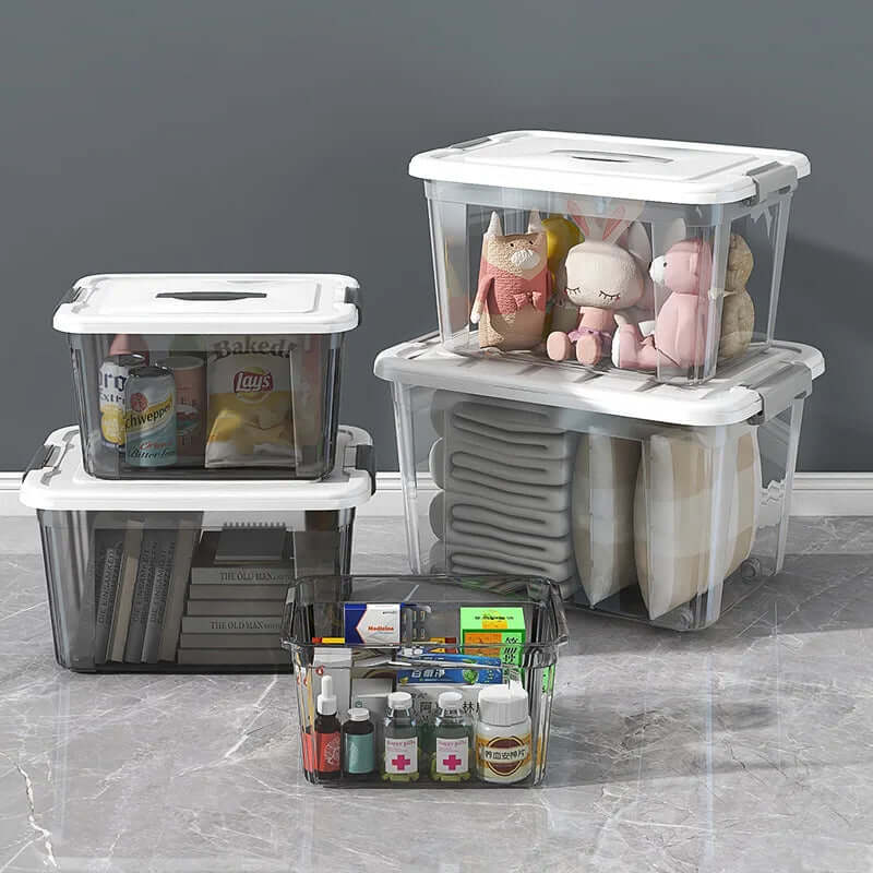 Clear plastic storage bins with white lids organizing toys, drinks, pillows, and medicine.