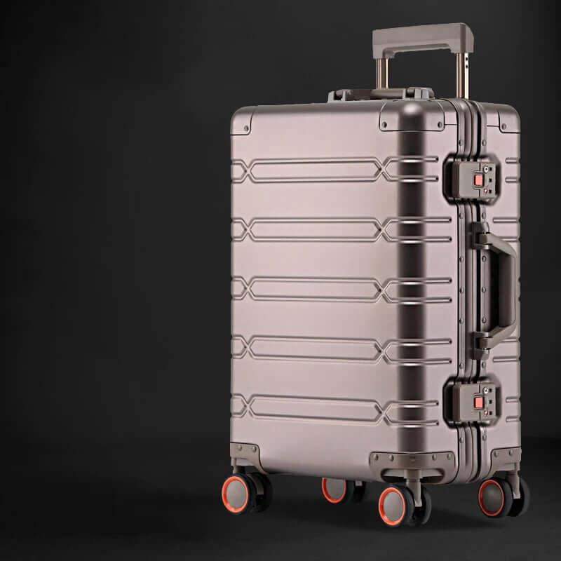 Metallic hard shell suitcase with four spinner wheels and telescoping handle on black background