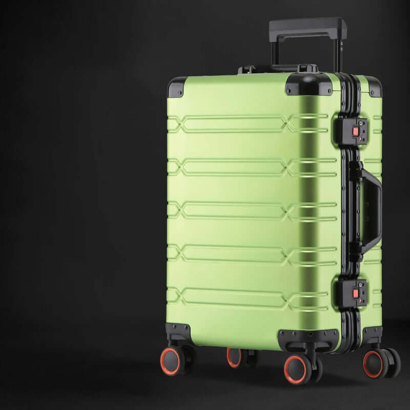 Green hard shell suitcase with black trim and red-wheeled spinner wheels on black background