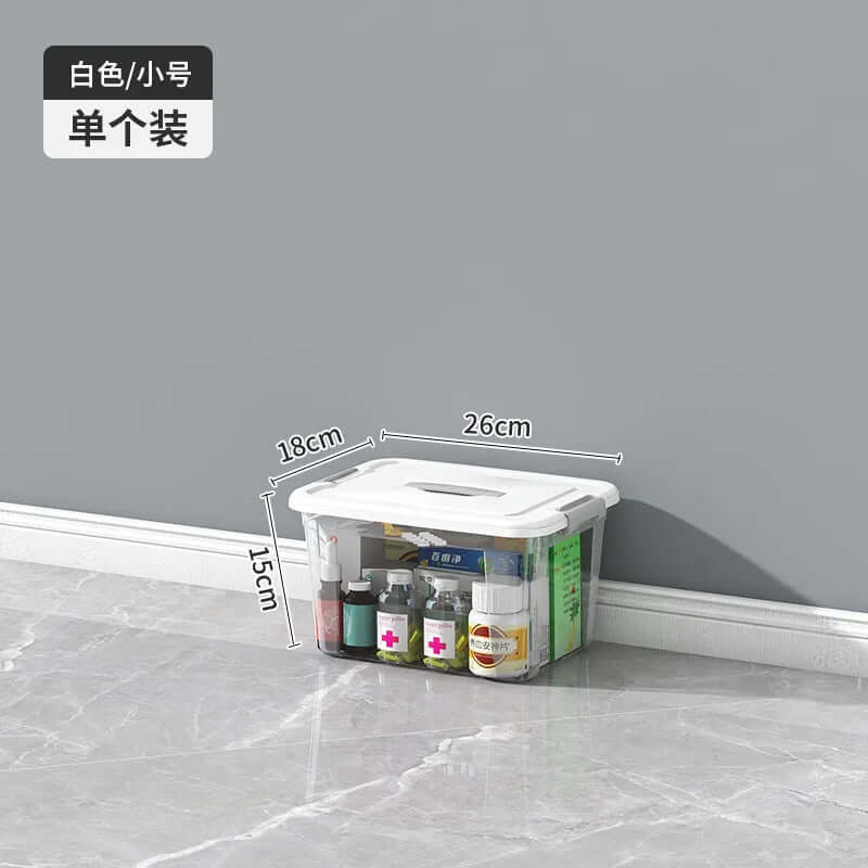 Clear plastic storage box with white lid, filled with medicine bottles, shown with size dimensions