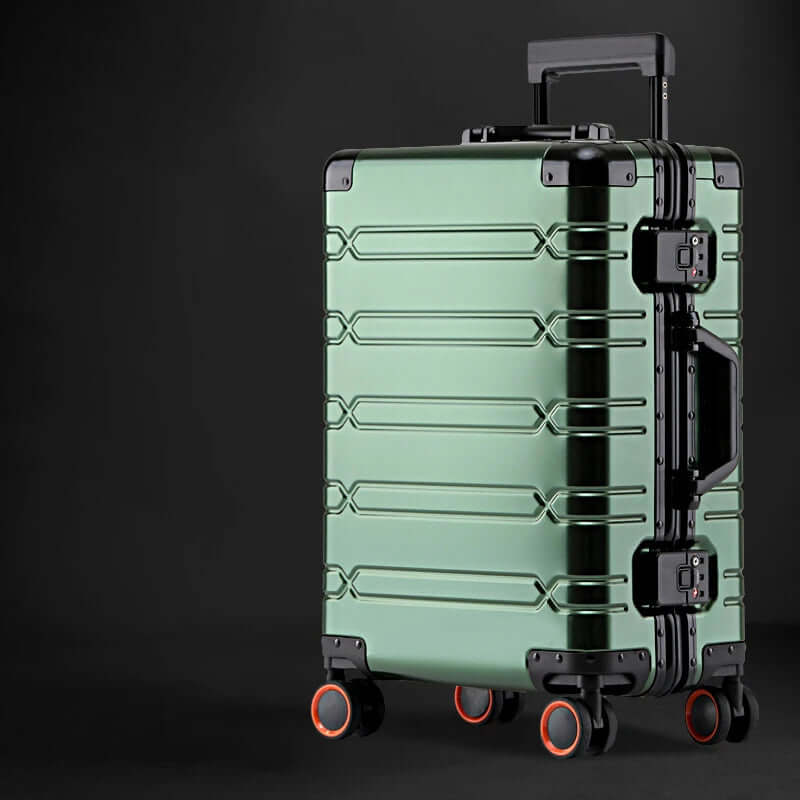Green hard shell suitcase with four wheels and black accents on a dark background