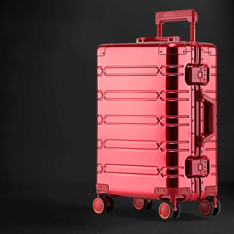Red hard shell luggage with wheels and telescopic handle on black background