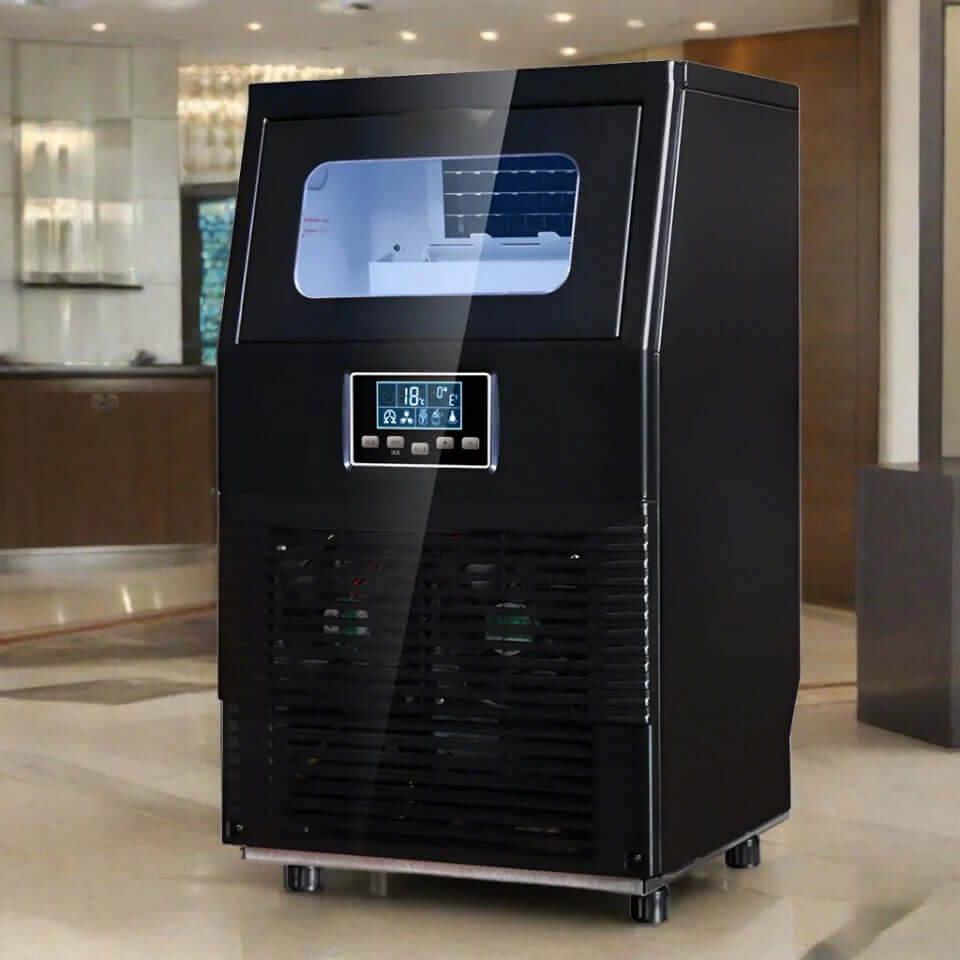 Commercial black ice maker machine with digital display in modern kitchen setting