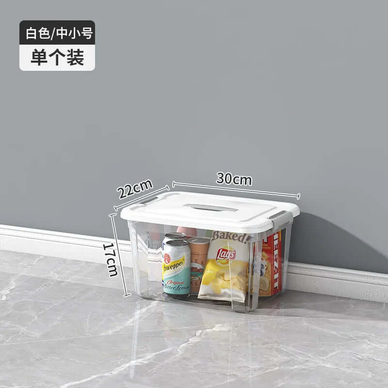 Clear plastic kitchen storage box with white lid, dimensions 30x22x17cm, storing snacks and drinks.