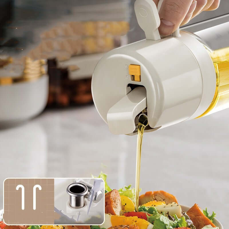 Oil dispenser with controlled pour spout pouring oil onto salad, kitchen accessory
