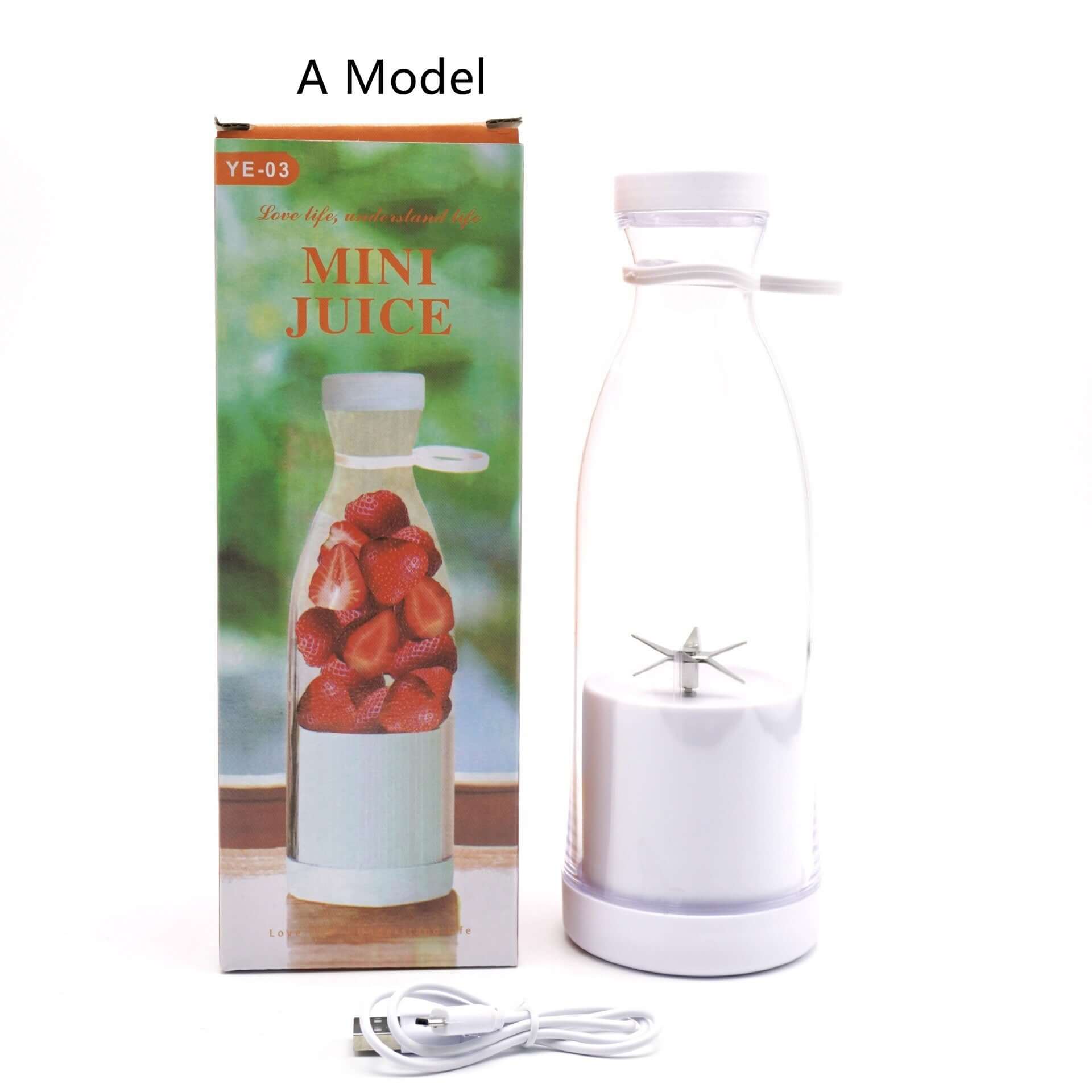 Portable mini juice blender with white base, charging cable, and retail box featuring strawberries.