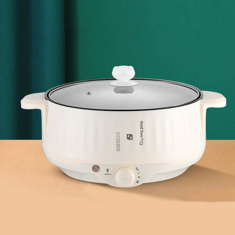 White electric slow cooker with glass lid and control knob, modern kitchen appliance
