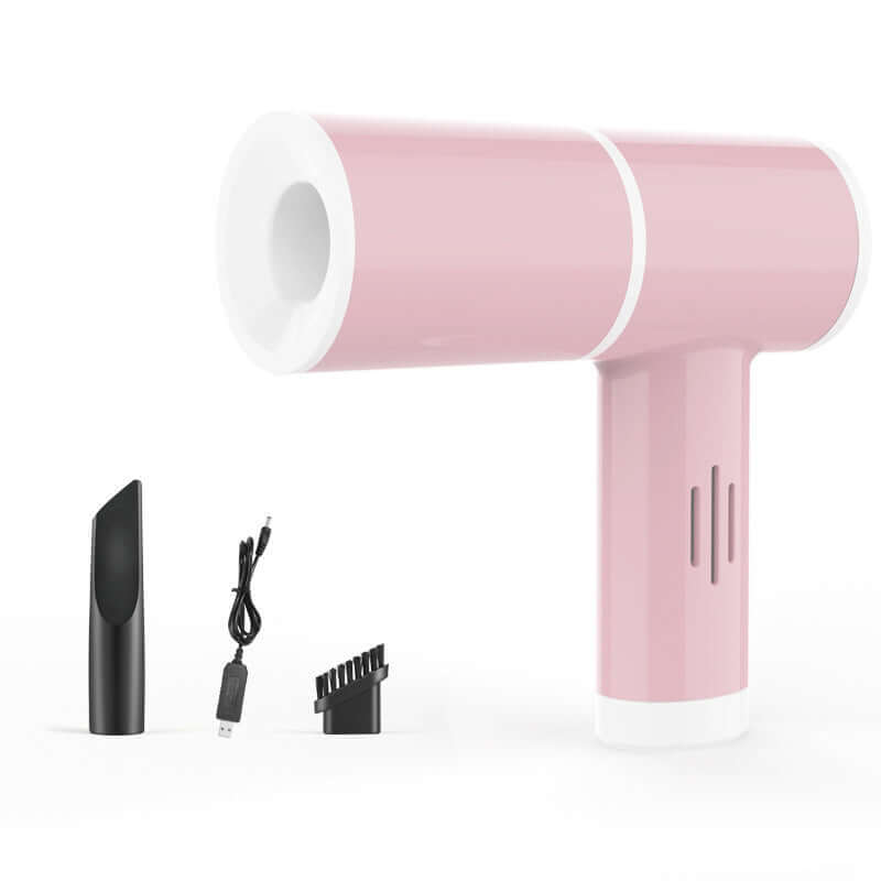 Pink handheld mini vacuum cleaner with USB charging cable, nozzle, and brush attachment