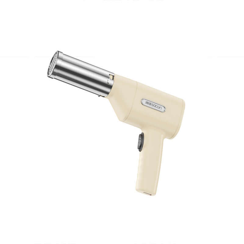 Handheld cream kitchen torch with beige handle and stainless steel nozzle for cooking