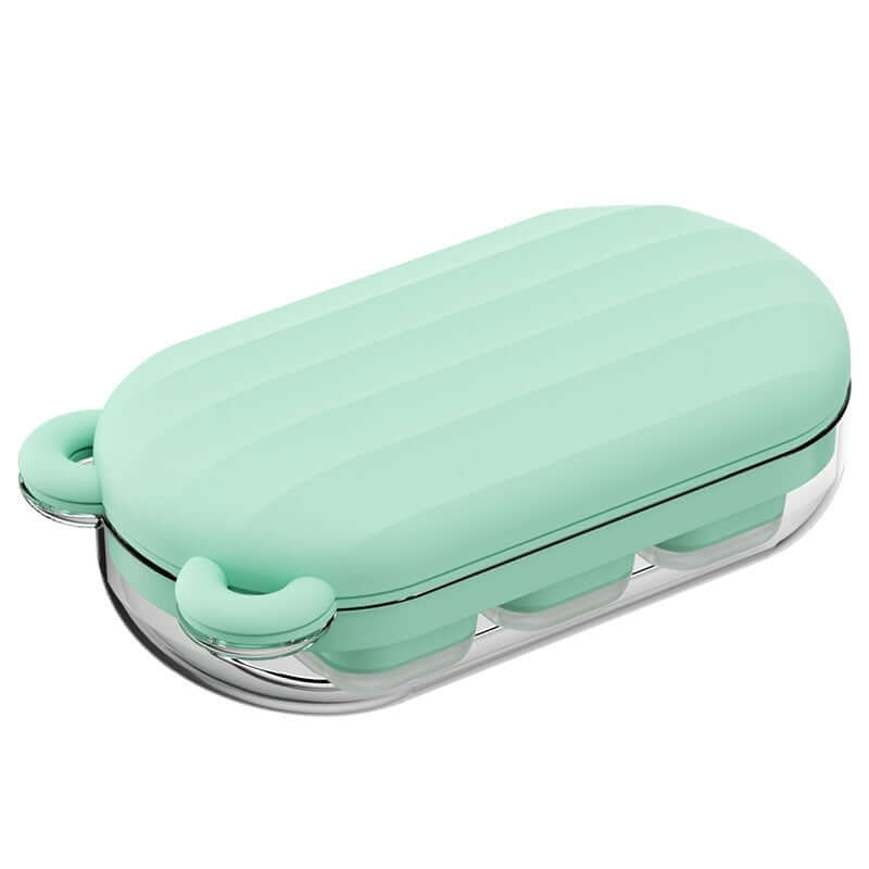 Mint green silicone kitchen storage container with clear base and secure lid