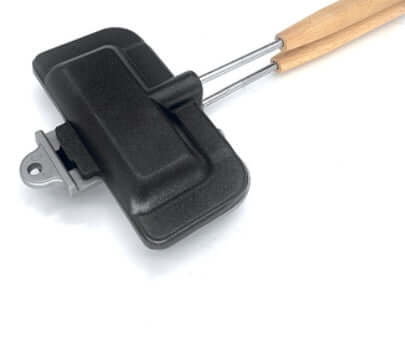 Cast iron sandwich maker with wooden handles, kitchen cooking accessory