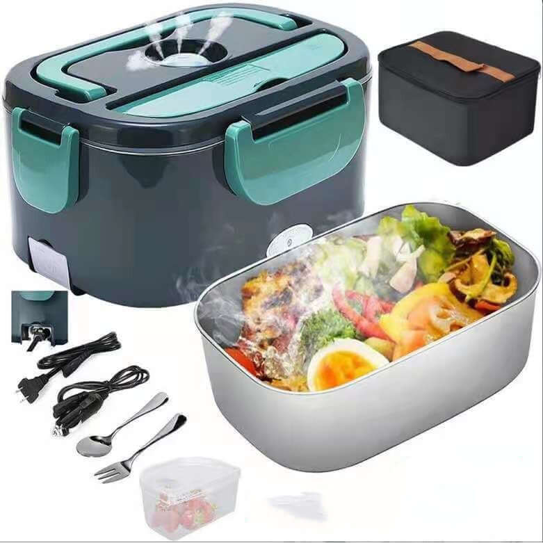 Electric heated lunch box with green handles, steaming food, utensils, cables, and carrying case