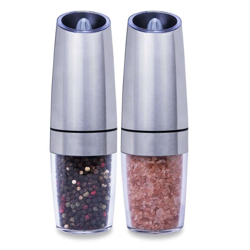 Stainless steel salt and pepper grinders set with visible spice compartments.