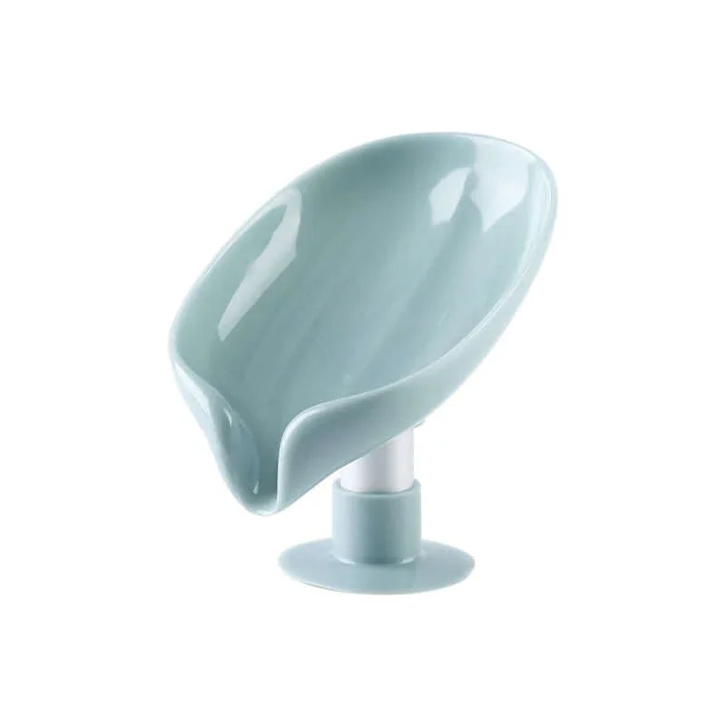 Light blue plastic kitchen sponge holder with drip tray and suction base