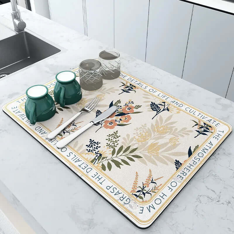 Floral kitchen drying mat with cups, glasses, and cutlery on modern countertop
