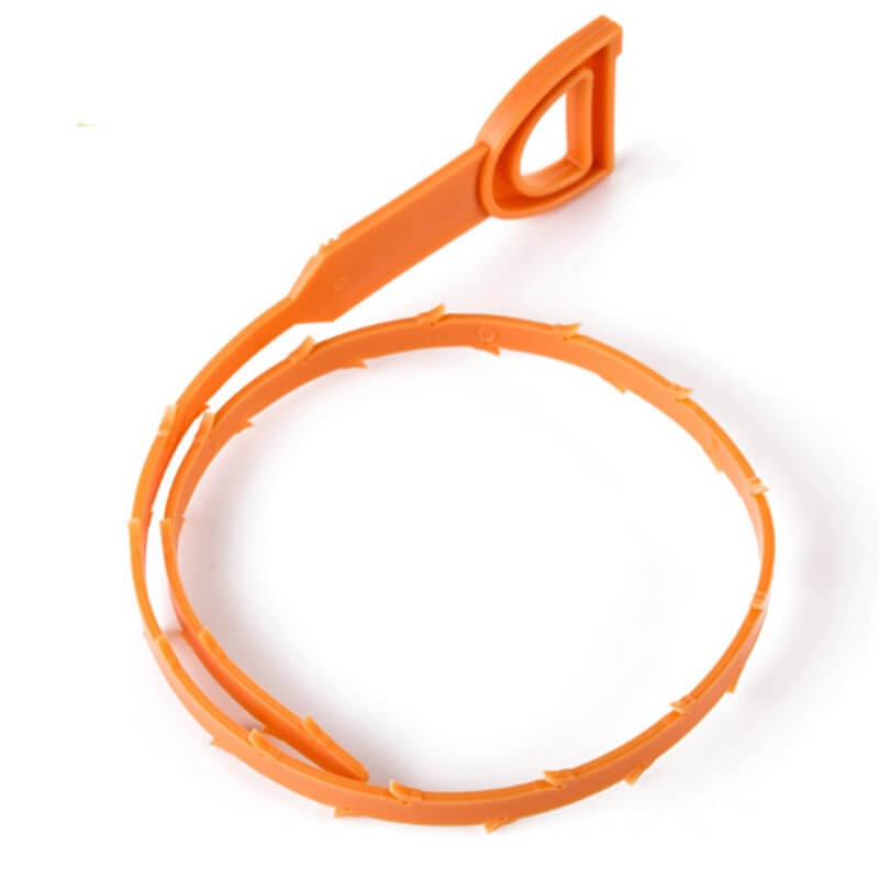 Orange plastic drain clog remover tool with barbed edges for kitchen sink cleaning