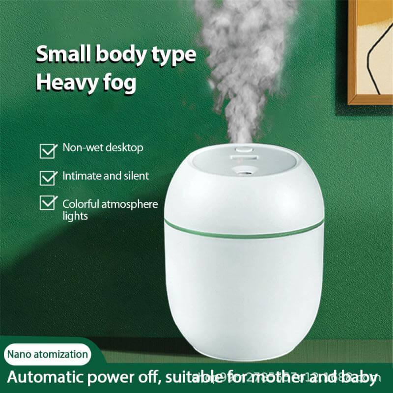 Compact white desktop humidifier with visible mist, silent operation, and colorful lights