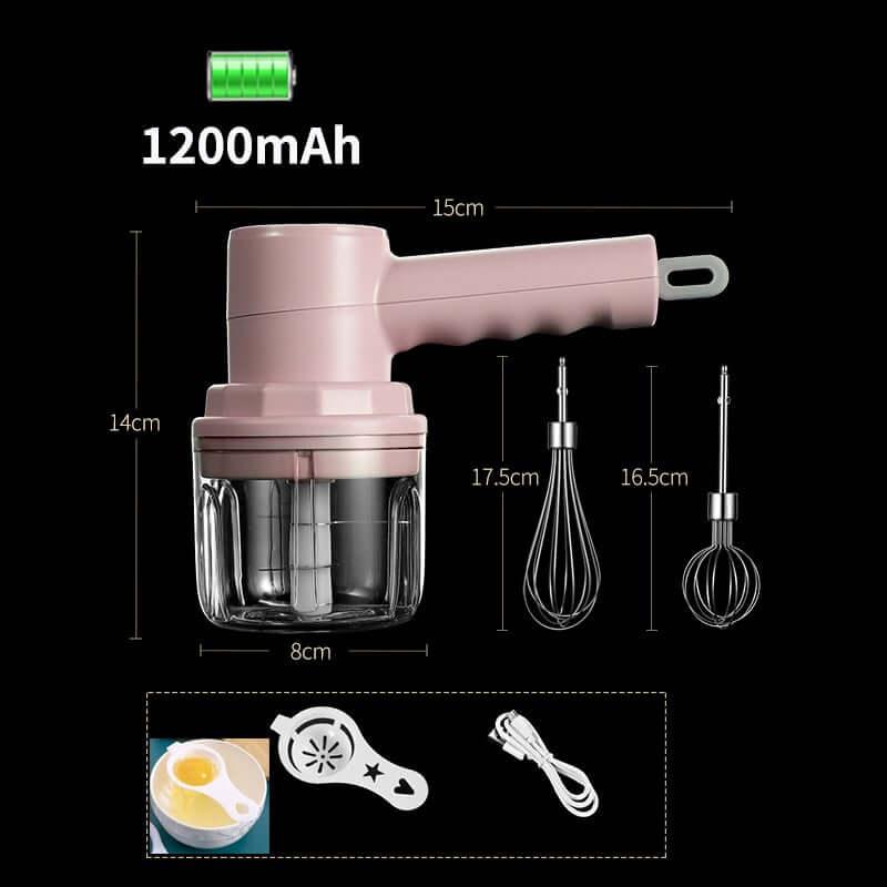 Cordless pink electric hand mixer set with two whisk attachments, glass bowl, battery icon, and USB charging cable, kitchen accessory for mixing and baking.