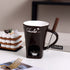Chocolate fondue mug set with fork, dessert, and tea light on kitchen table