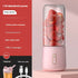 Pink portable blender with strawberries inside, USB-C charging, kitchen appliance features displayed
