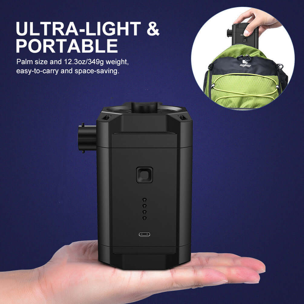 Compact black portable kitchen appliance held in hand, lightweight and easy to carry.