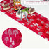 Red Christmas table runner with white tree pattern, festive decor and utensils on table