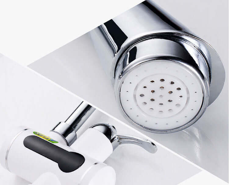 Stainless steel kitchen faucet with white and black handle and spray nozzle close-up