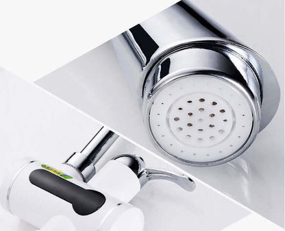 Stainless steel kitchen faucet with white and black handle and spray nozzle close-up