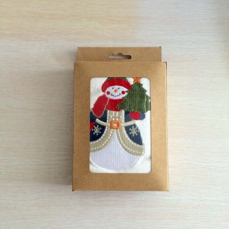 Christmas kitchen towel with snowman and tree, packaged in brown gift box