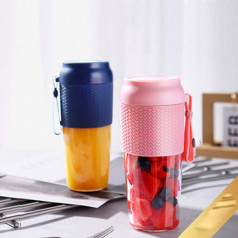 Reusable travel cups with fruit and juice, featuring colorful silicone grips on a kitchen counter
